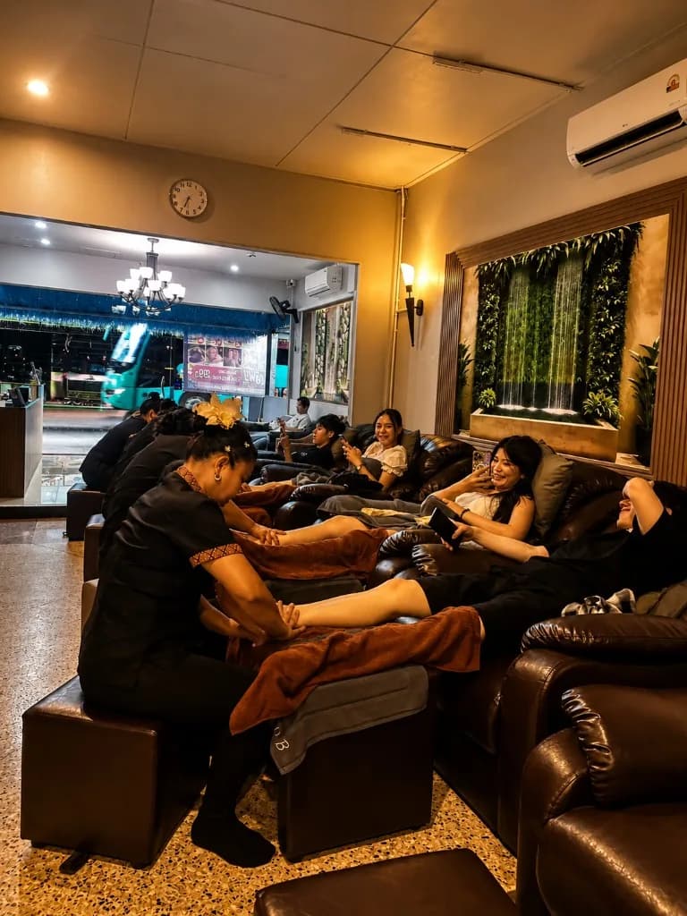 Happy guests laughing and relaxing during foot massage at HOB Thai Massage Phuket